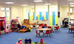 Interior view of the newly built Friary Pre-School in Crawley, West Sussex, showing the bright learning space and colourful interior.