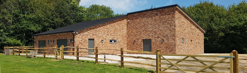 Exterior view of Pease Pottage Community Centre and playing field