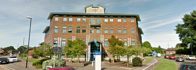 Panoramic exterior view of Crawley Police Station in Crawley, West Sussex, where Fowler Building Contractors carried out roofing, fascia and soffit works in 2016. The building was occupied throughout.