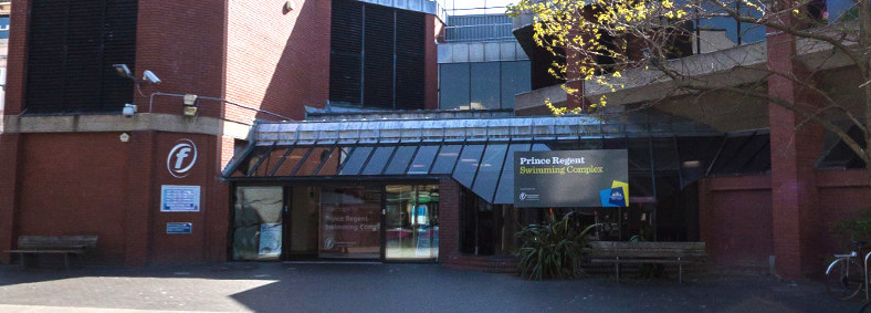 Exterior view of the attractive glazed foyer at the Prince Regent Leisure Centre in Brighton, East Sussex, built by Fowler Building Contractors.