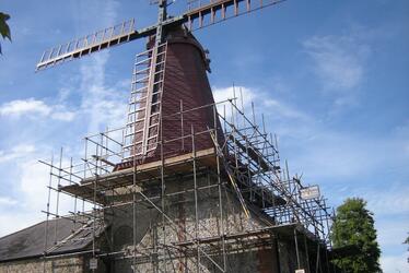 Photograph showing Blatchington Windmill enshrouded in scaffold during restoration works