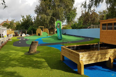 Photograph of the rubber crumb race course and children's play equipment